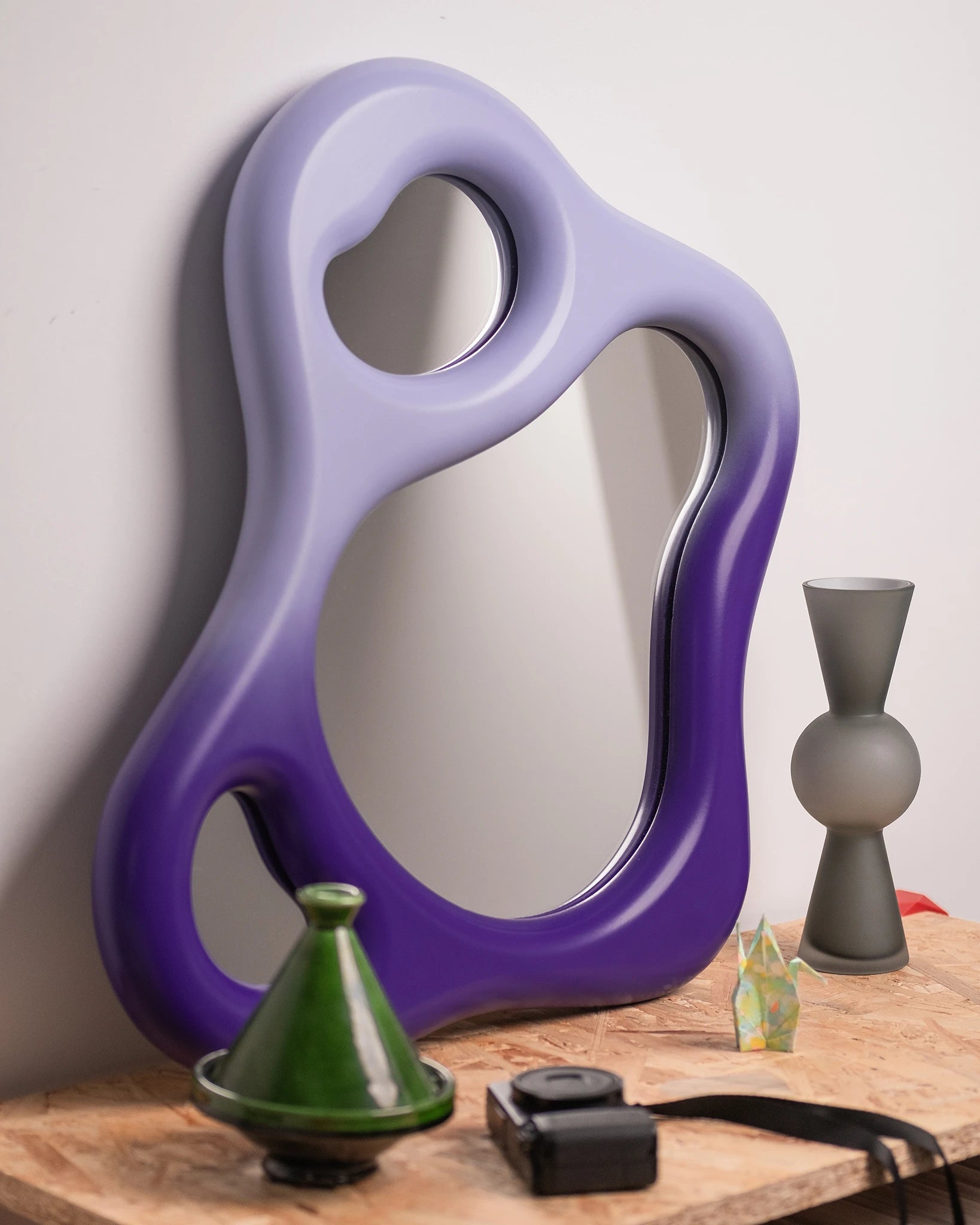 wall mirror in a domestic setting with soft edges and wooden frame, gradient purple lacquered